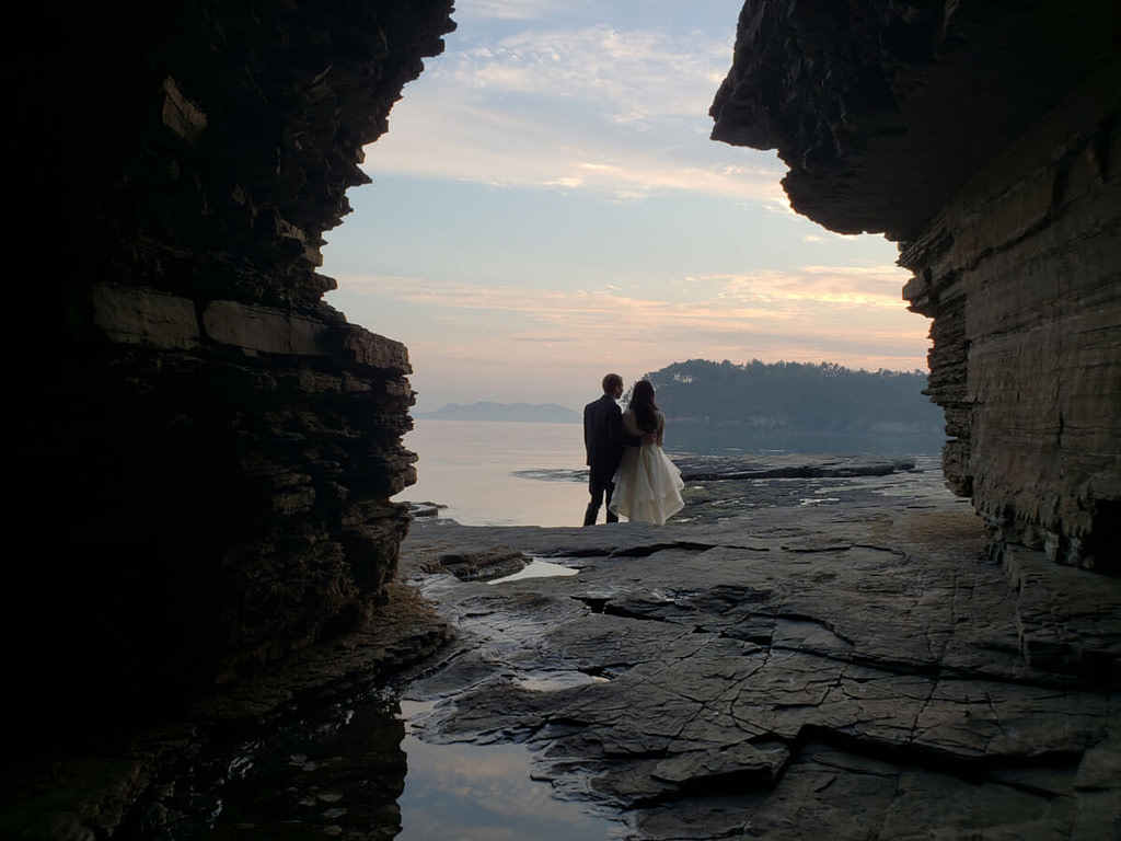 Wedding photo around the cave at sunset