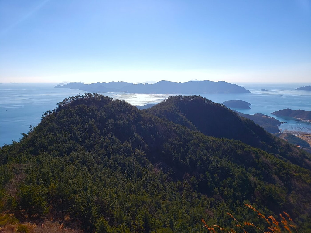 Smaller peaks covered in trees