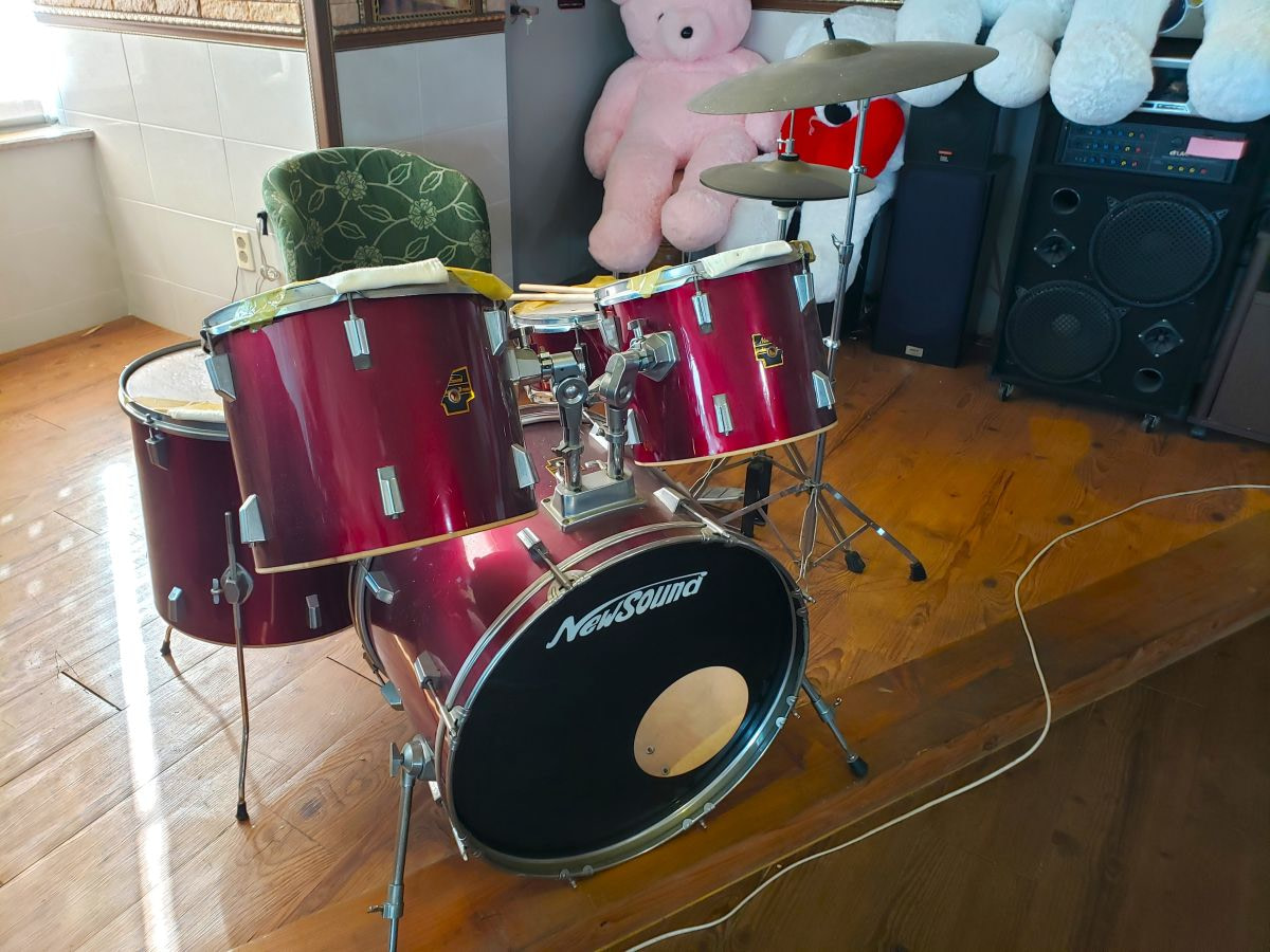 A red drumset at the Korean café Muin with teddy bears