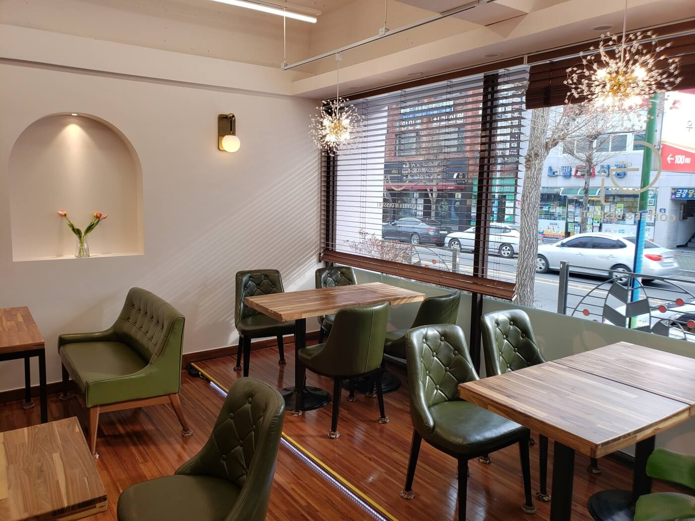 Comfortable green cushiony chairs in Grace J Café in Goseong, Korea