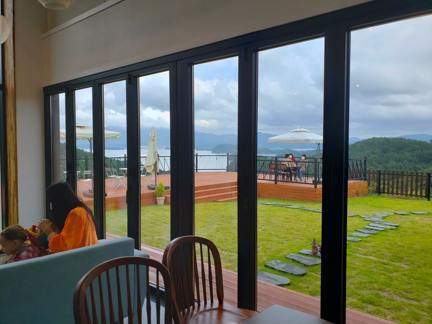 Seating along a window and grassy yard