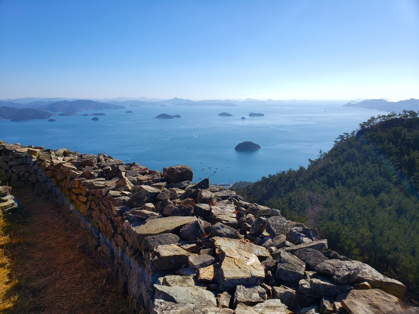 A closeup of the rock wall against the sea