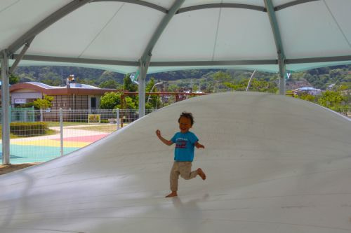 A toddler running in a jumping pit at Baegse Park in Goseong, Korea