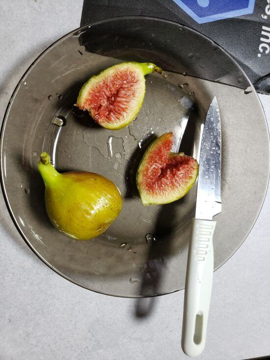 Figs cut open on a dish