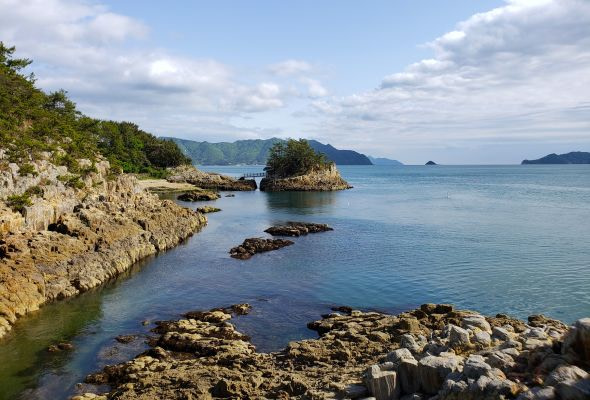 Tiny island surrounded by a calm sea and other islands and peninsulas in Korea