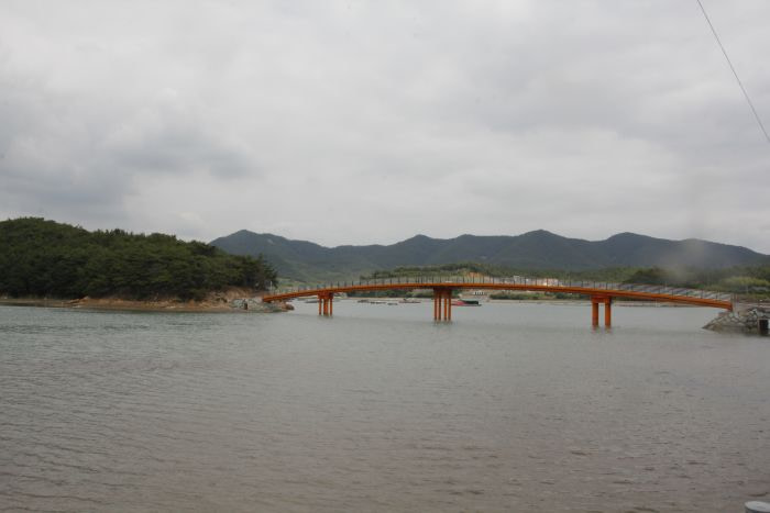 The orange bridge to Boli Island at high tide