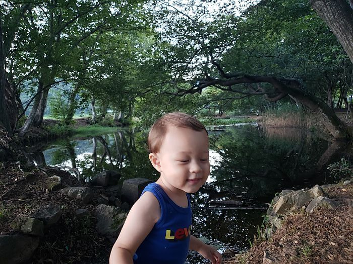 Noah in front of Jangsan Forest and pond