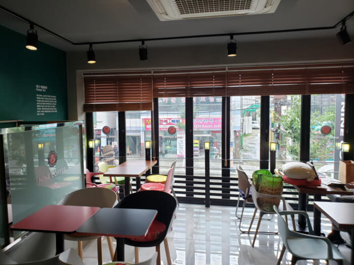 Tables and large window on second floor