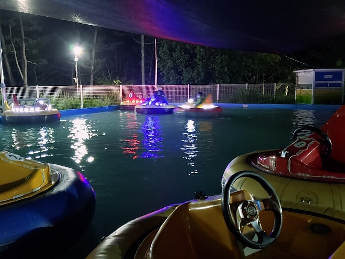 Bumper boats lit up at night at Danghangpo land