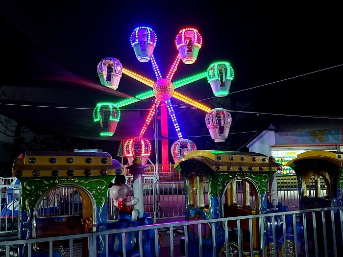 Ferris wheel in Danghangpo Land lit colorfully at night