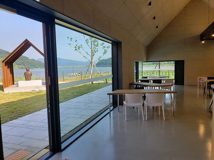 View of iron structure from large windows within the book café