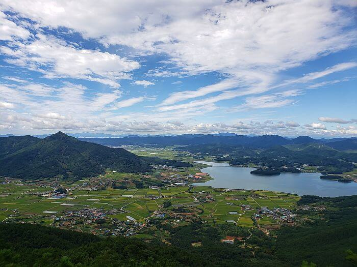 Mountaintop view of sea and mountains and rice paddies