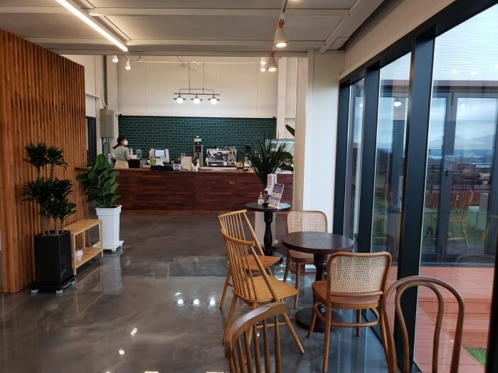 The interior of Dupoli Café with tables next to windows