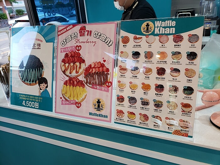 The menu of waffles at the Waffle Khan counter