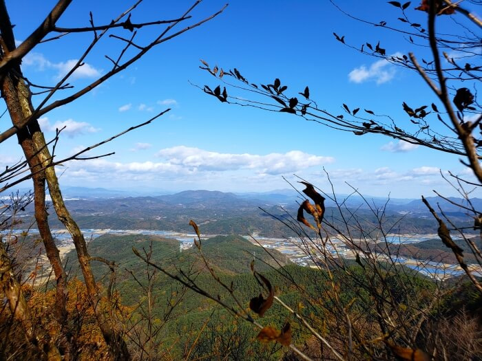 View of rolling peaks and towns in the distance from around Peak #2
