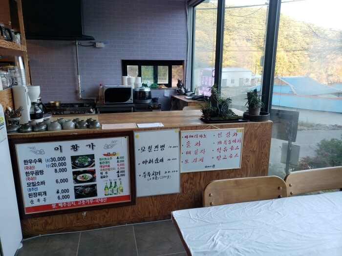 Menu items posted at a restaurant counter