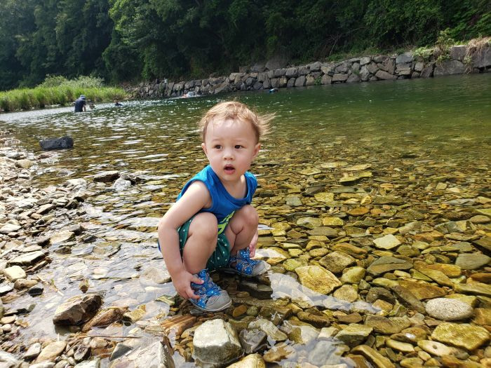 Baby Noah squatting in a clean river