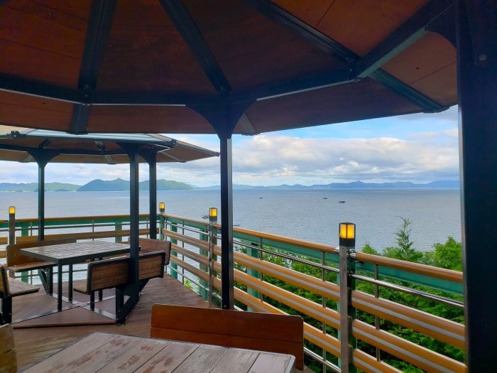 Covered tables on an outdoor deck at Haetmaji Café