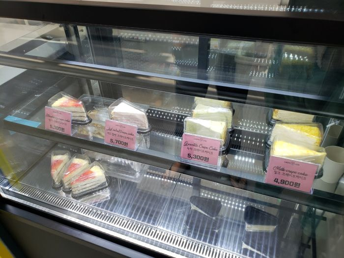 Slices of crepe cakes on display at Crepe Lion