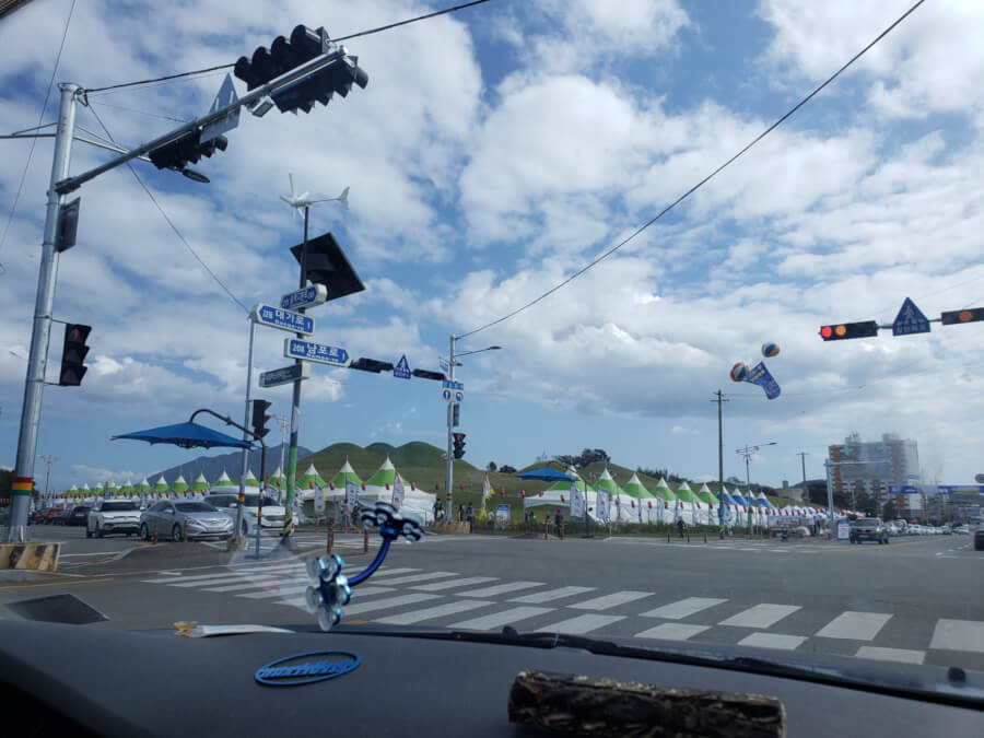 Tents lined up along the road for a festival
