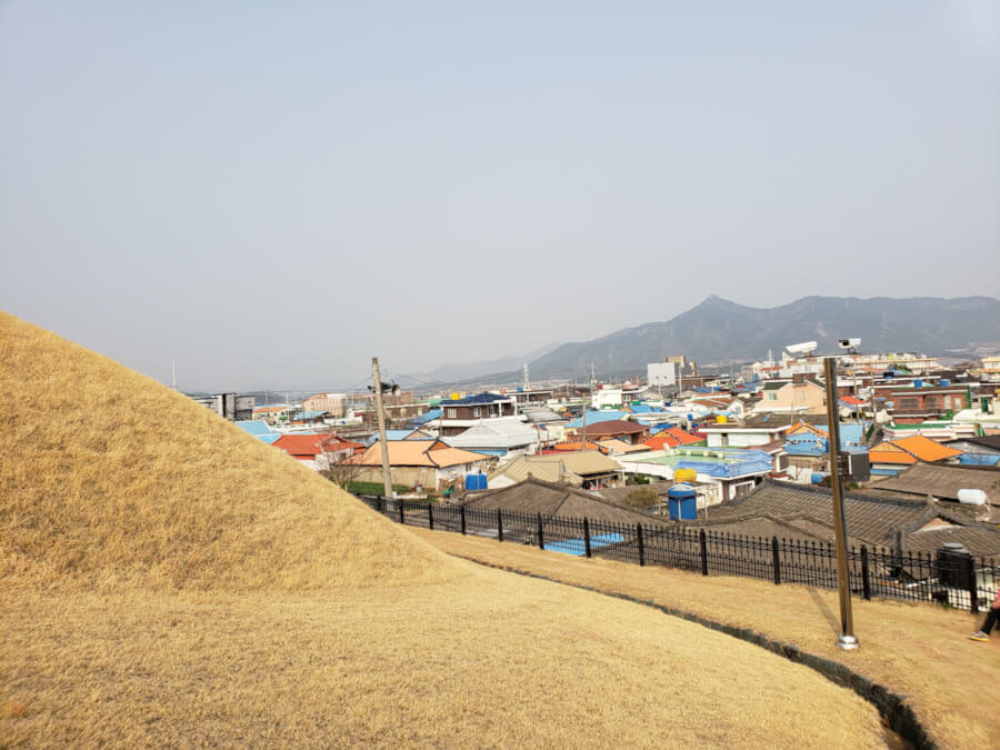 A walking trail running along the edge of a tomb bordering the city