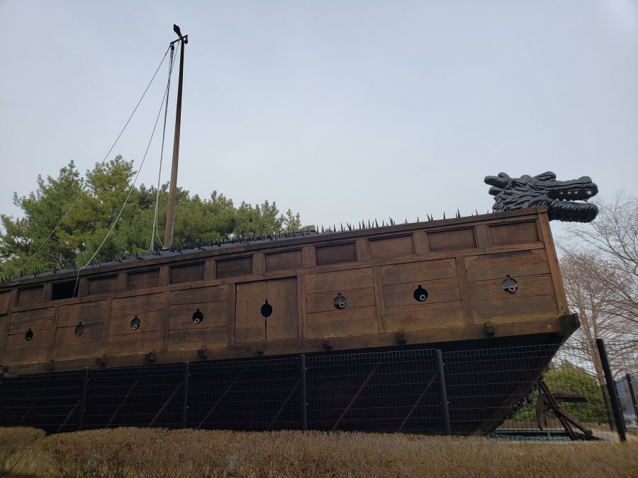A life-size turtle boat with a dragon head and spikes