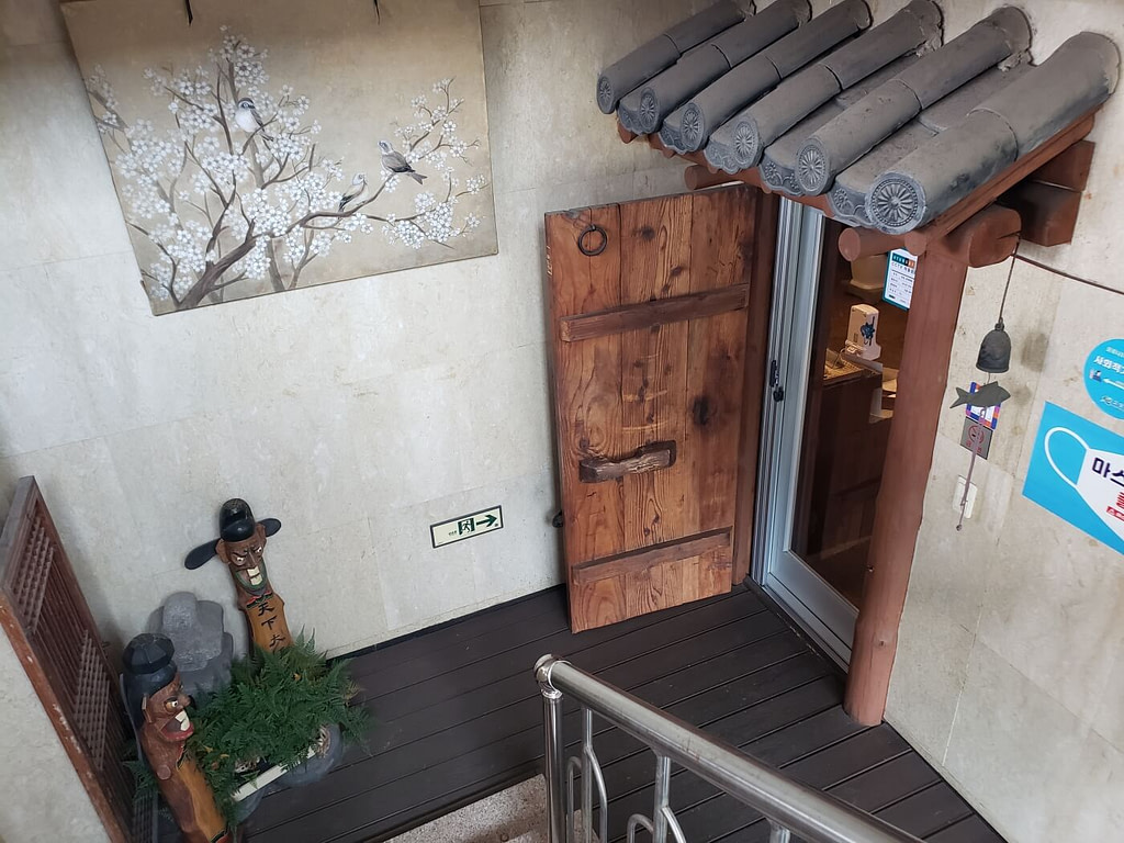 A wooden door at the entrance to a Korean traditional teahouse