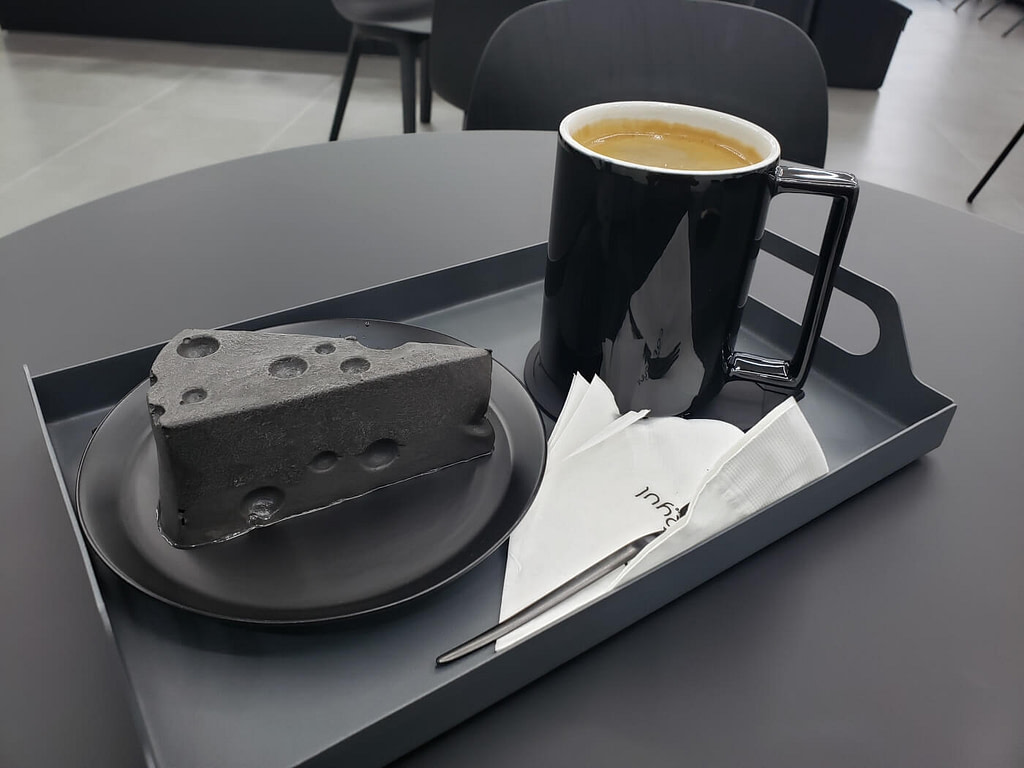 Ryul Café featured black cheesecake with a mug of coffee