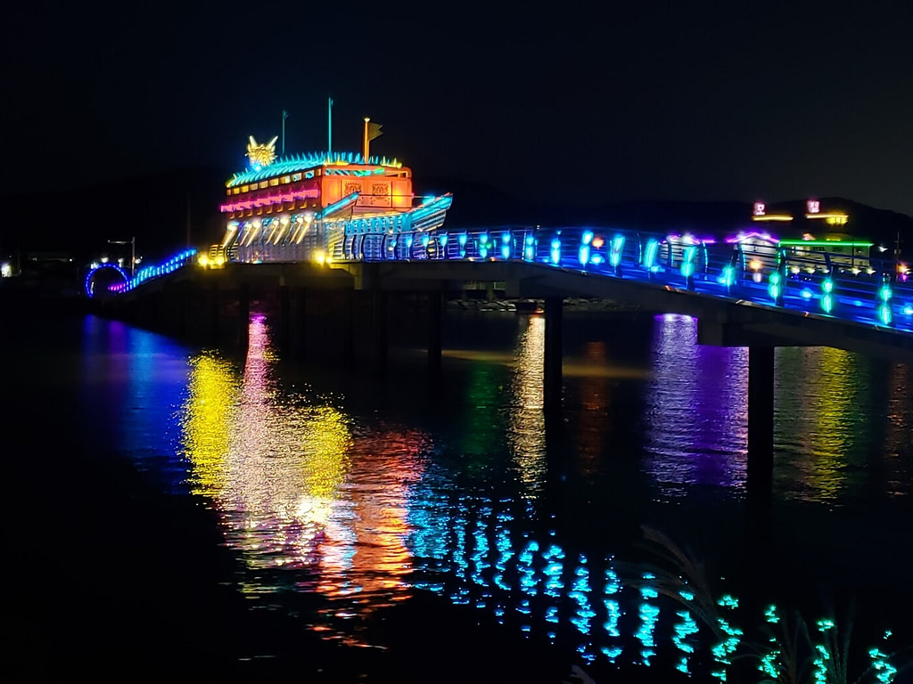 A turtle ship with metal spikes on a pedestrian bridge