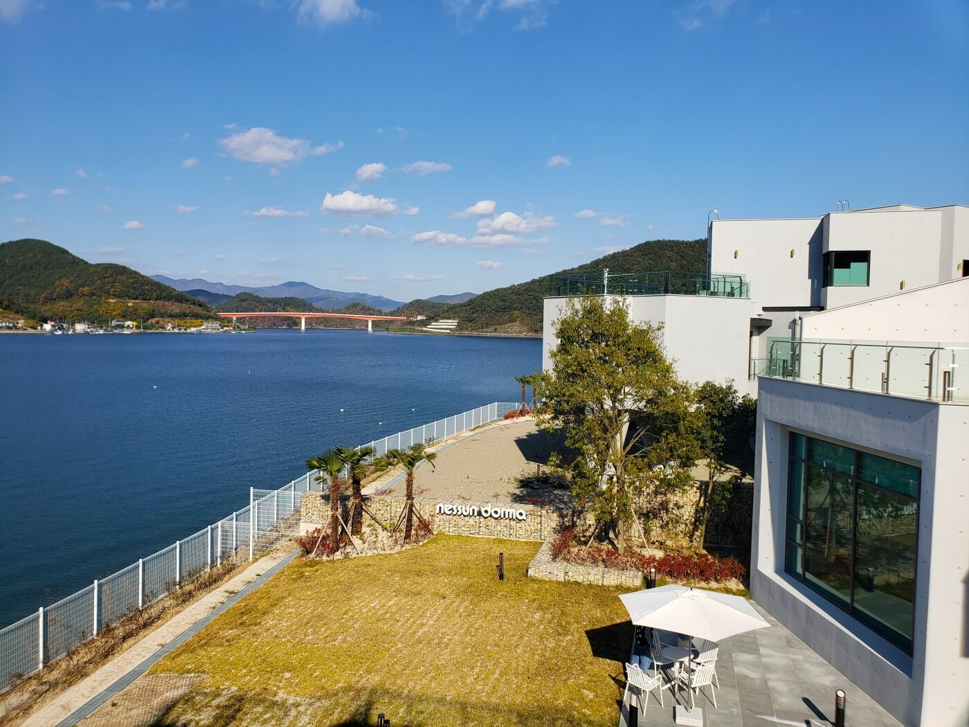 A café yard and patio below along the water