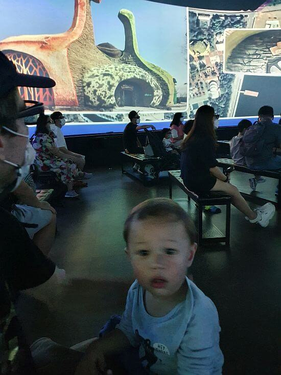 Baby Noah with a confused look on his face in a 5D theater