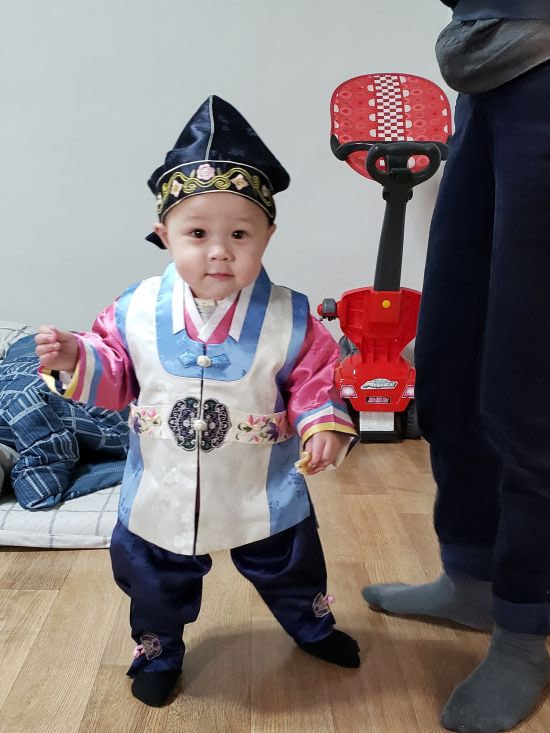 Baby Noah wearing a traditional Korean hanbok
