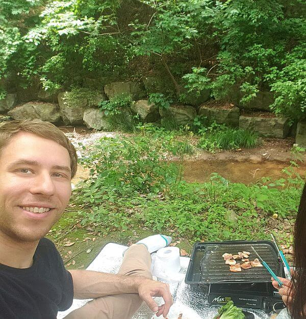 Nate and Alice grilling near the stream at Galmobong Forest