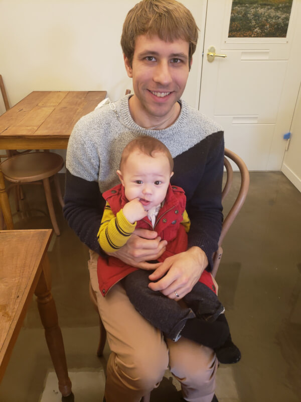 Noah sitting in Nate's lap
