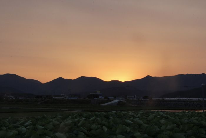 A sunset against mountains in Goseong, Korea