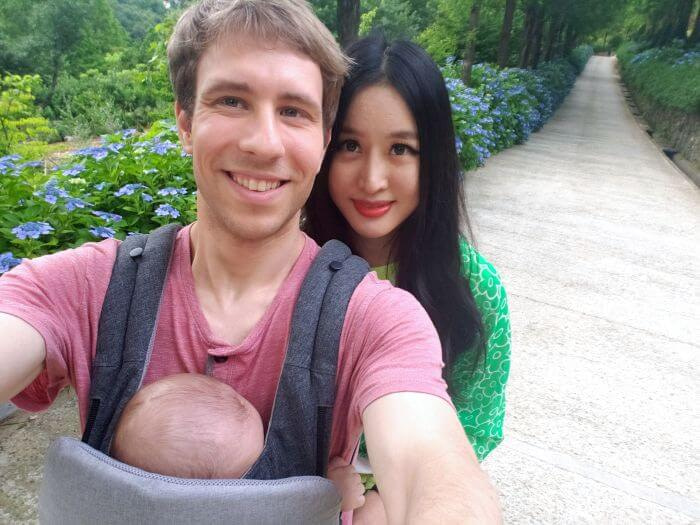 Family selfie along the roadway with blue hydrangeas