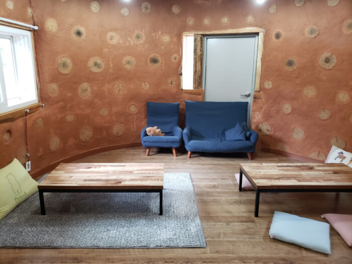 Inside room with floor tables and a small sofa