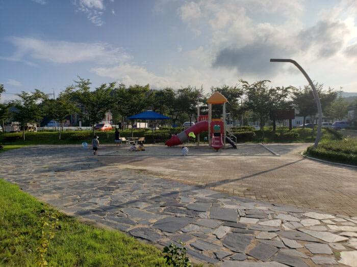 Playground at Baegse Park with children playing near sunset