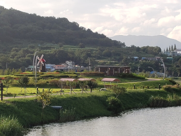 Cute windmill on a small hill overlooking Sunam Reservoir