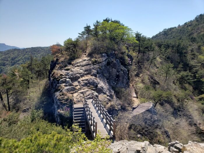 Geobug Rock connected by a bridge with stairs leading down below the bridge