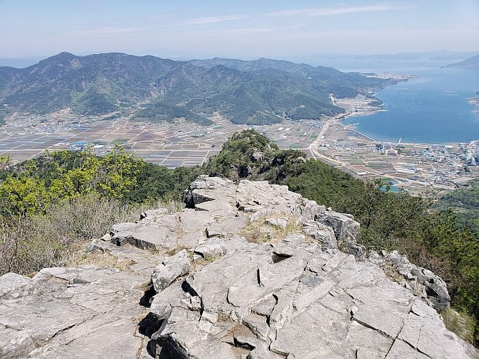 View of Geobug Rock from the peak showing a bridge connecting to the smaller peak