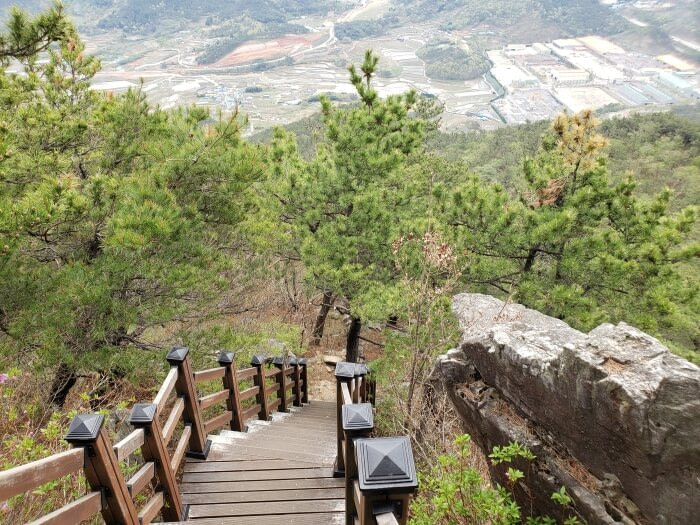 Looking down the steep set of stairs with the villages down below