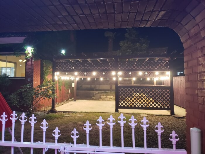A picnic table surrounded by lights at night at Dalgotjeongwon Café