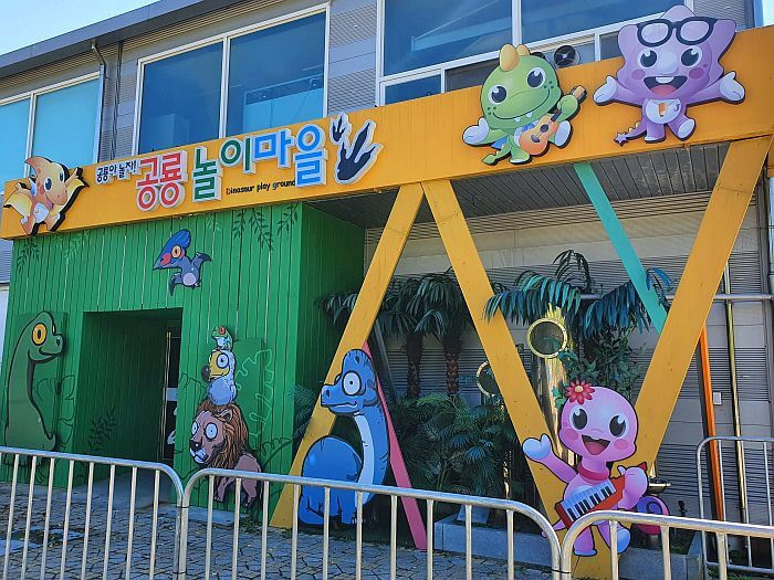Little characters around the entrance to the building of the kids indoor dinosaur play area