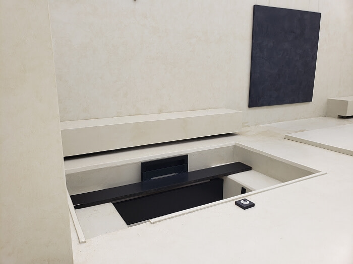A cut out area in the concrete area for seating