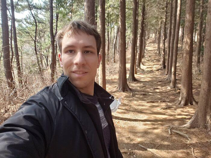 Nate between two rows of cypress trees
