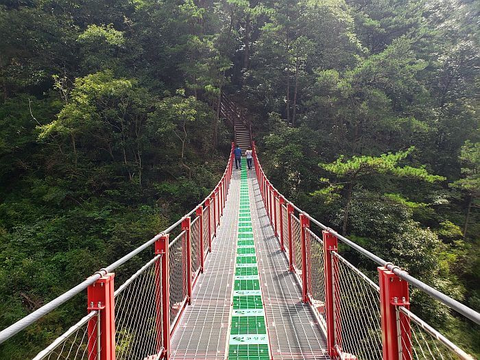 A look down one end of a suspension bridge to the other