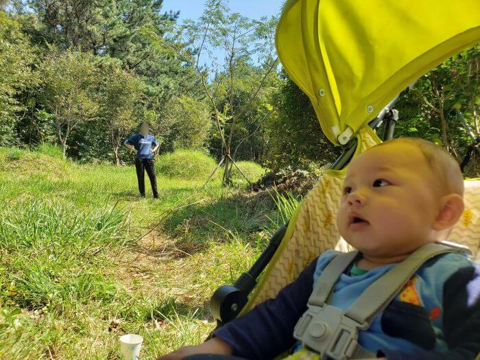 Noah in a stroller next to burial mounds