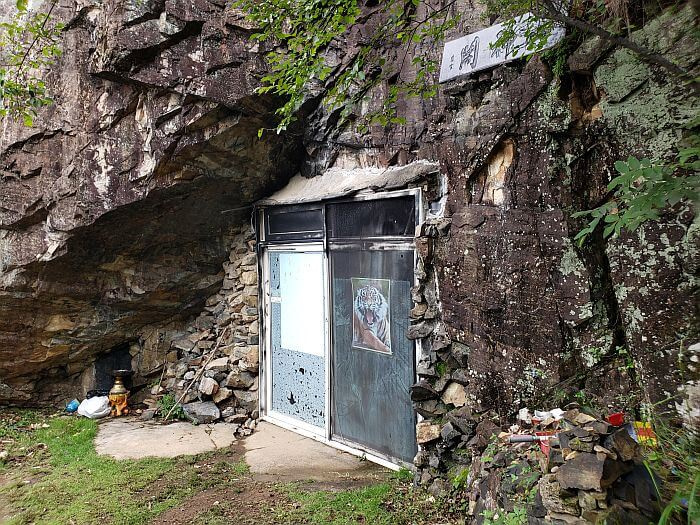 A sliding door embedded in a rock