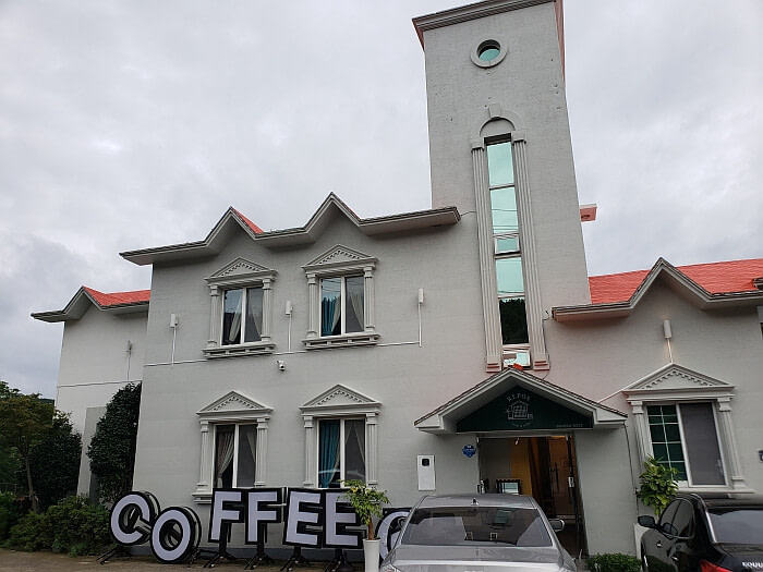 Front of Repos Café with European style windows and architecture